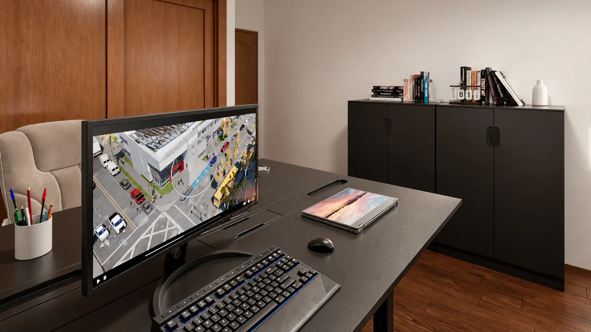Secretária com monitor e arrumação para livros no gabinete
